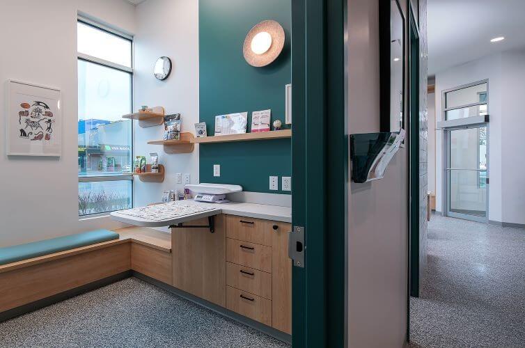Comfortable exam room with a window bench and exam table at our veterinary hospital in Kelowna